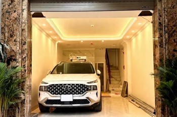 trần quốc hoàn DT 45m x7 tầng thang máy 21,7 tỷ phân lô,gara ô tô,kinh doanh